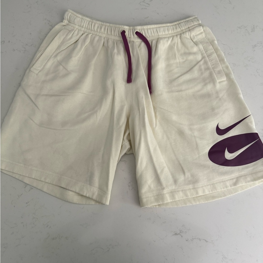 Nike Athletic Cream Shorts with Purple Details